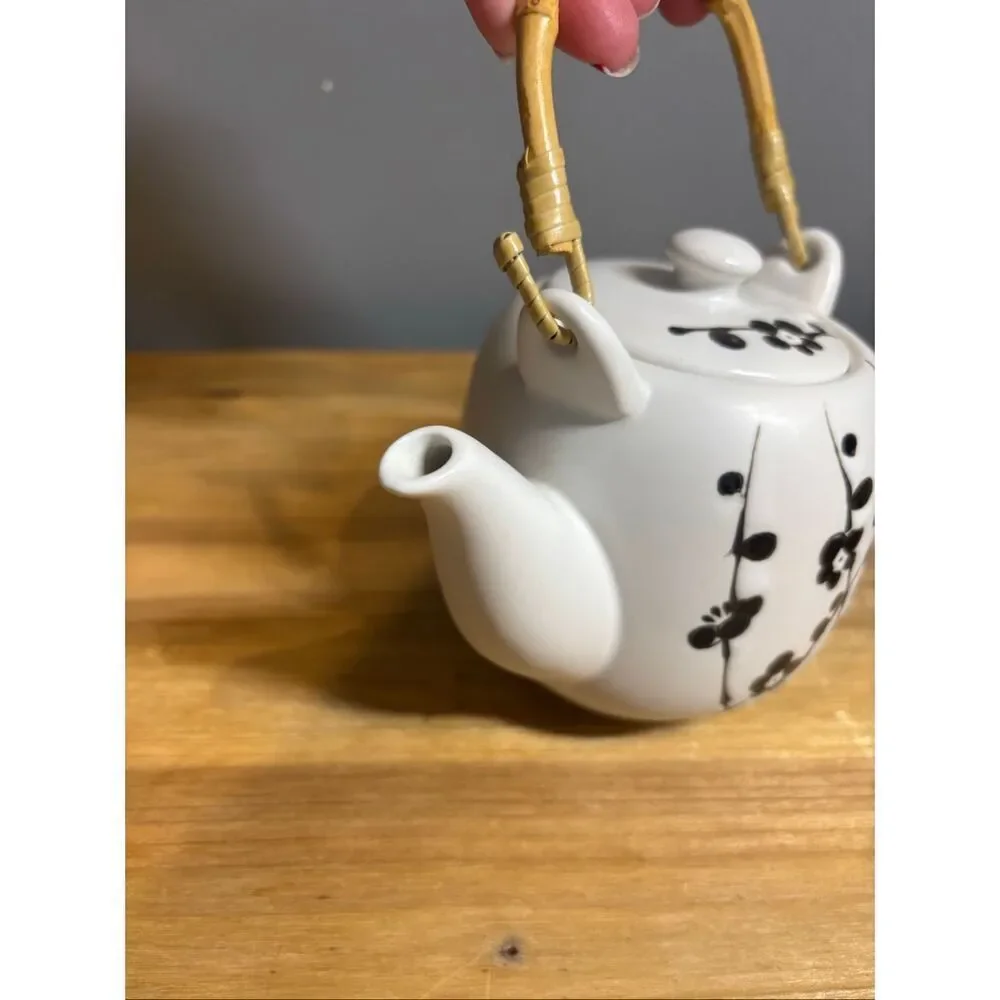White ceramic tea pot and 4 tea cups with black cherry blossoms